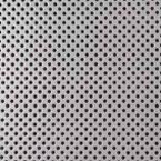 A white sheet with black polka dots on it.