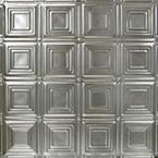 A silver metal wall with squares and rectangles.