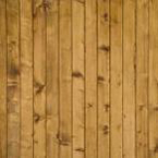 A wooden wall with many planks of wood.